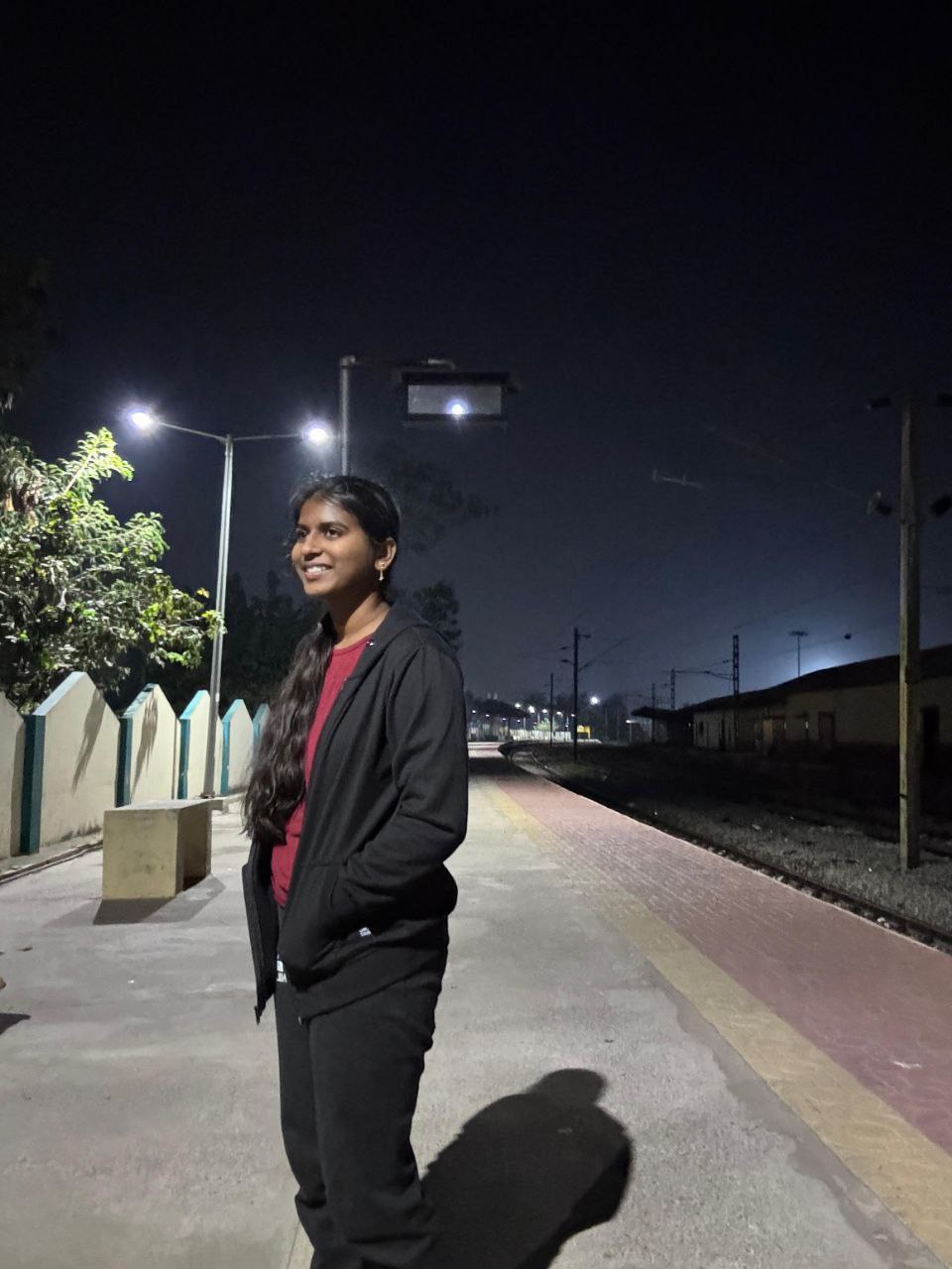 Kavya speaking at an event